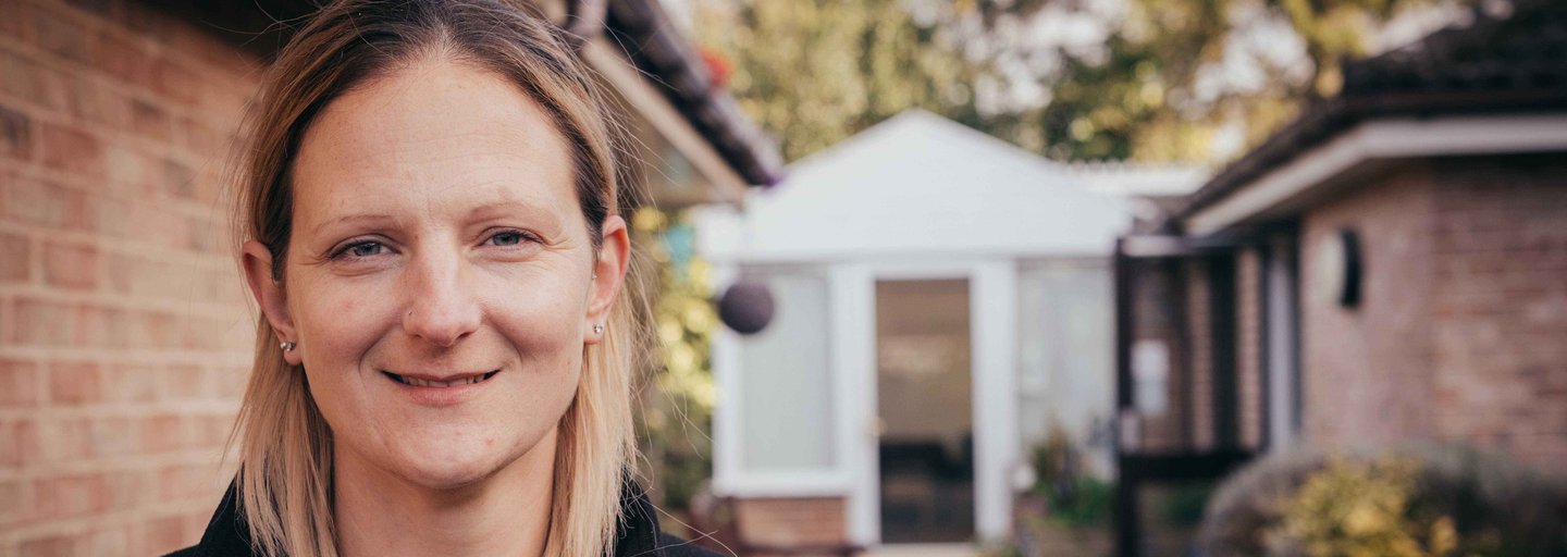 Woman working as a support worker smiling